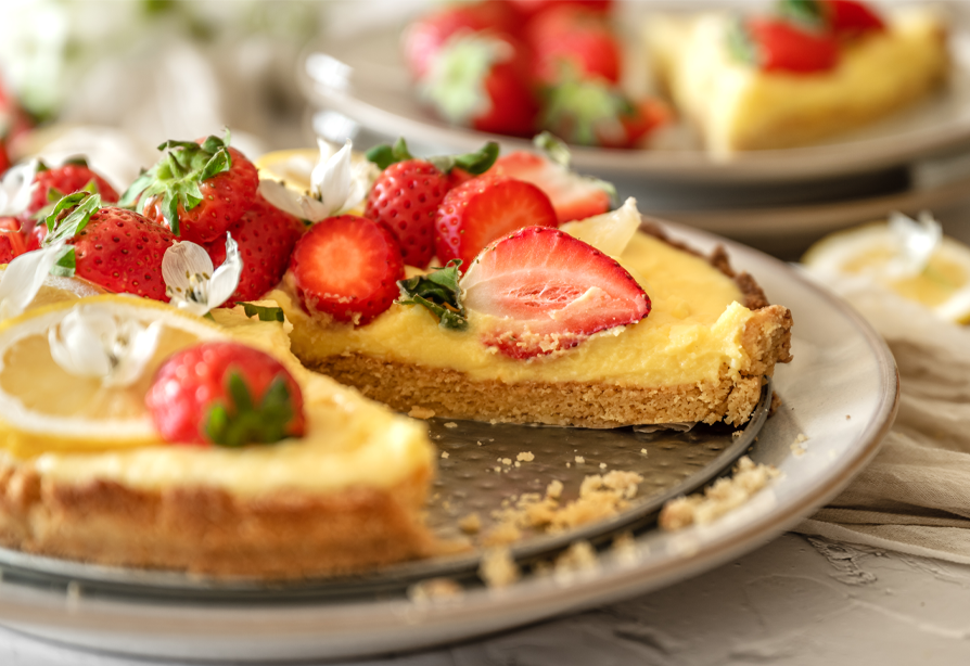 Tangy lemon custard pie with strawberry slices on top