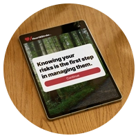 A tablet displaying the Risk Screen tool, with writing on the screen that reads Knowing your risks is the first step to managing them.