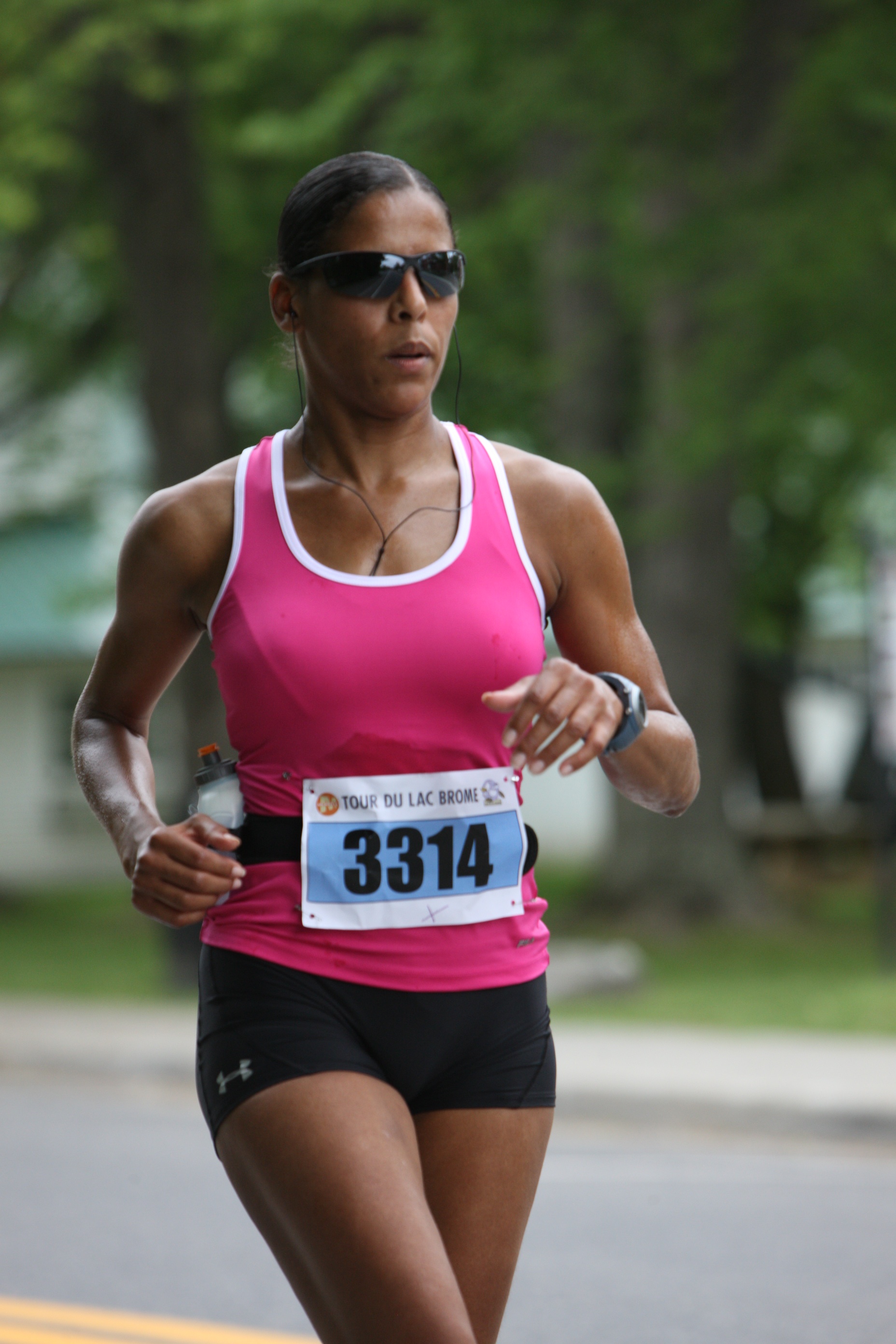 Caroline Lavallée runs wearing a race bib