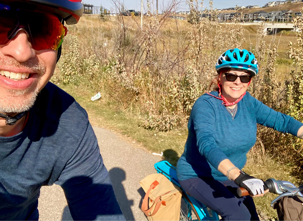 Christina and her husband Sven biking outdoors