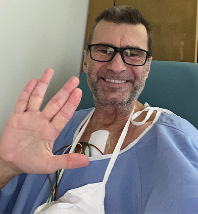 Dr. Doug Eyolfson in a hospital gown after his bypass surgery.