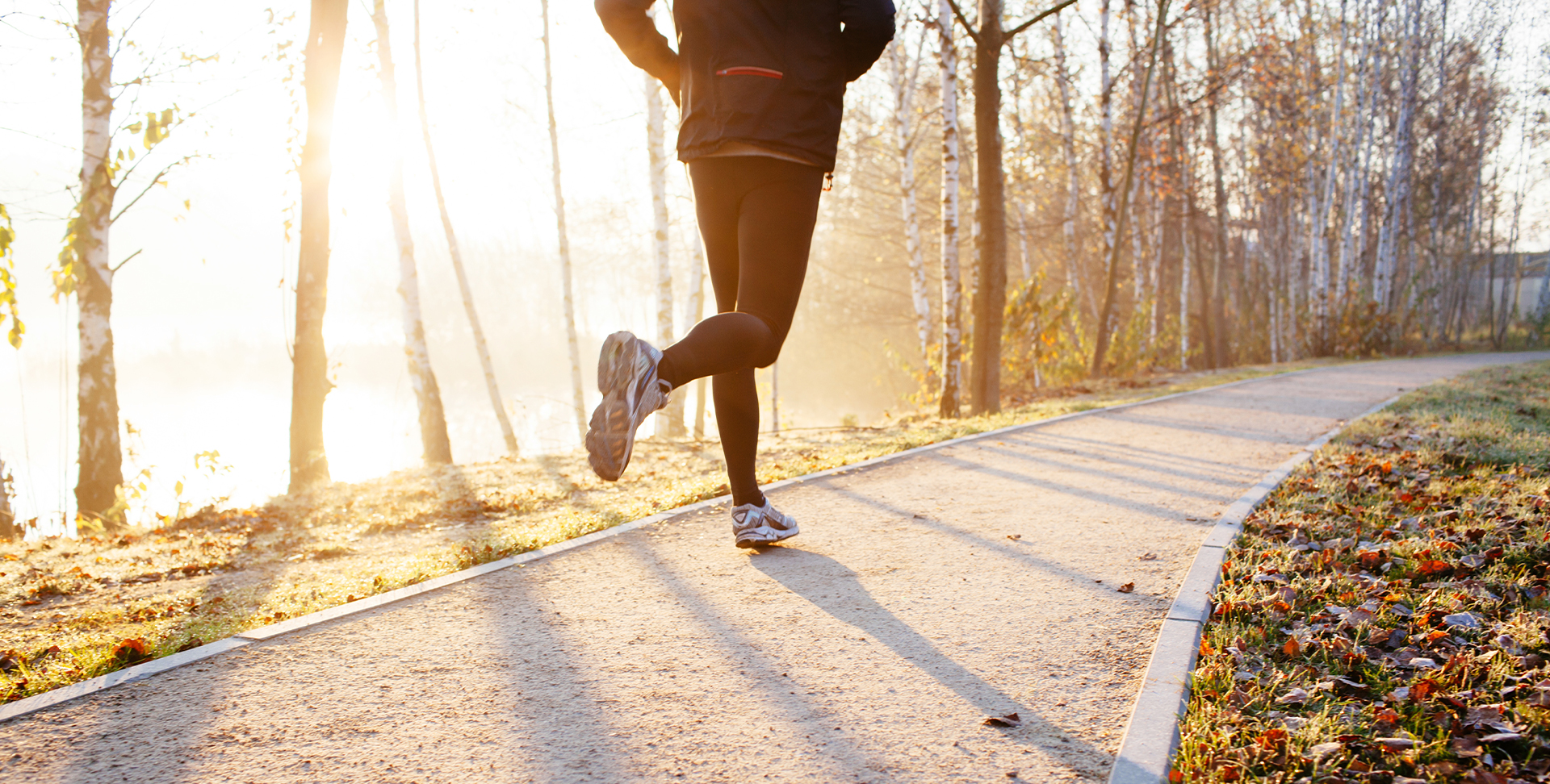 A man running on a trail in the morning