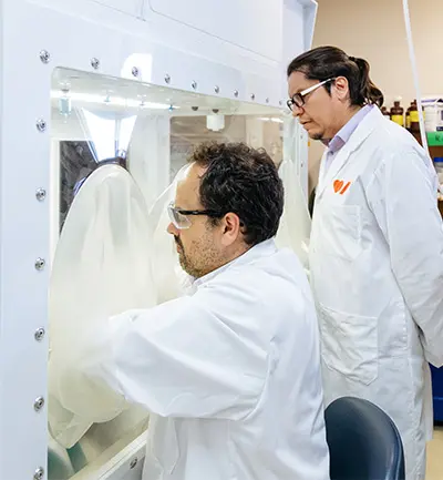 Dr. Emilio Alarcón with his research assistant, Marcelo Munoz, in their lab. 