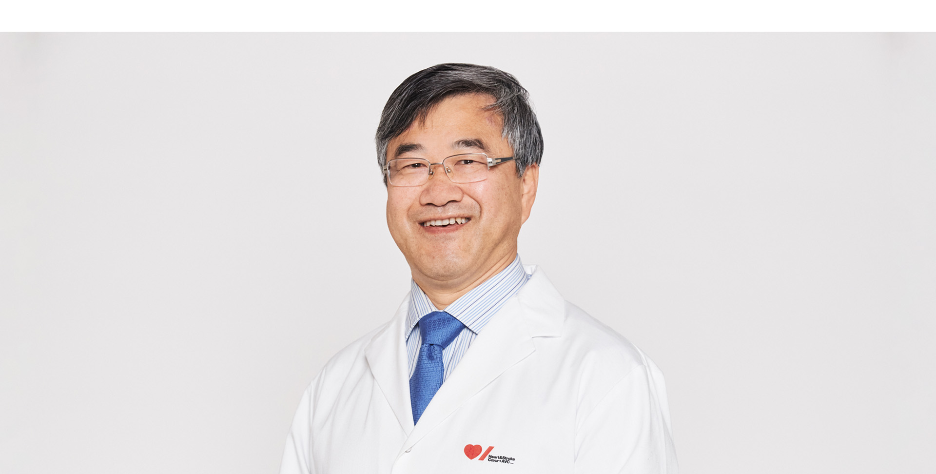 Doctor Ren-Ke Li wearing a Heart & Stroke lab coat