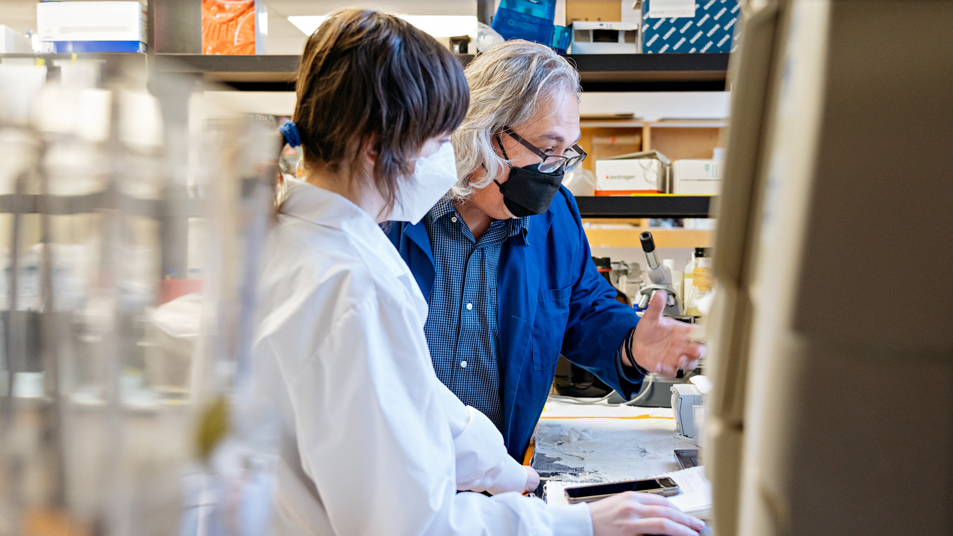 Dr. Glen Pyle talking to a member of his research team