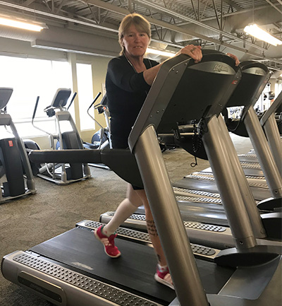 Heather Evans using a treadmill at the gym