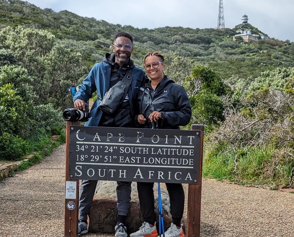 Katherine and her husband Sheldon behind the Cape Point sign in South Africa.
