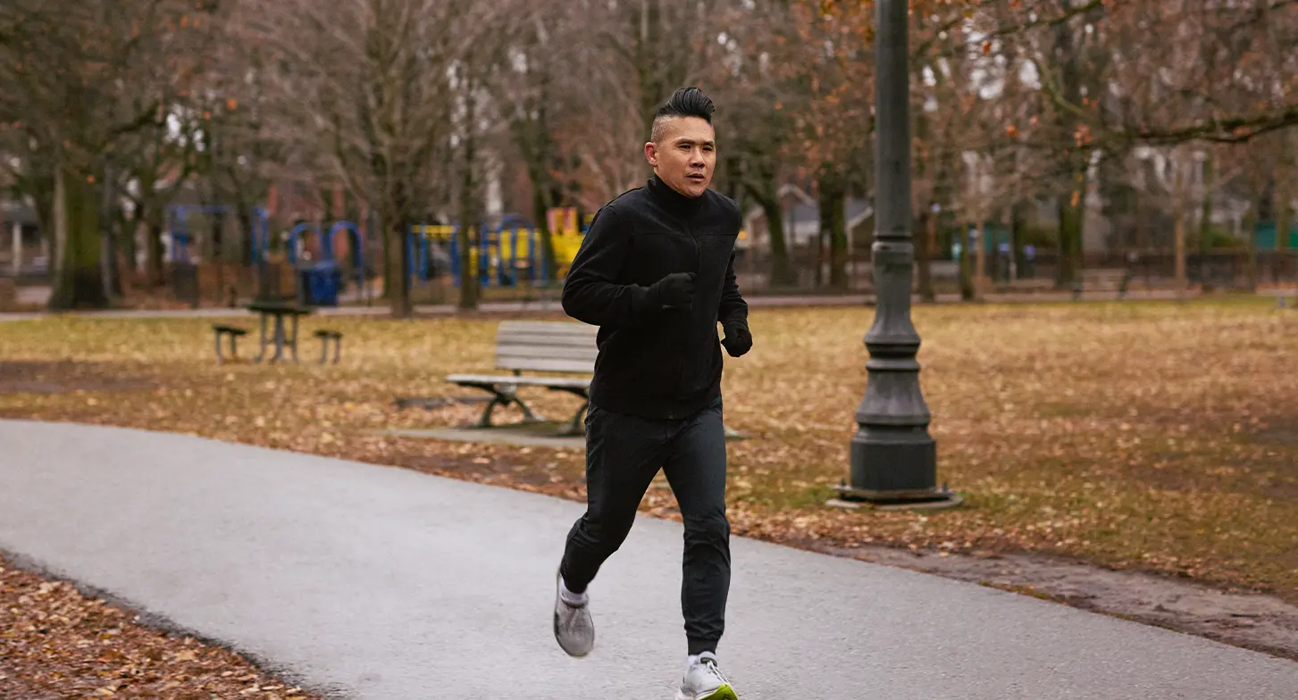 Ken Wong jogging in a park.