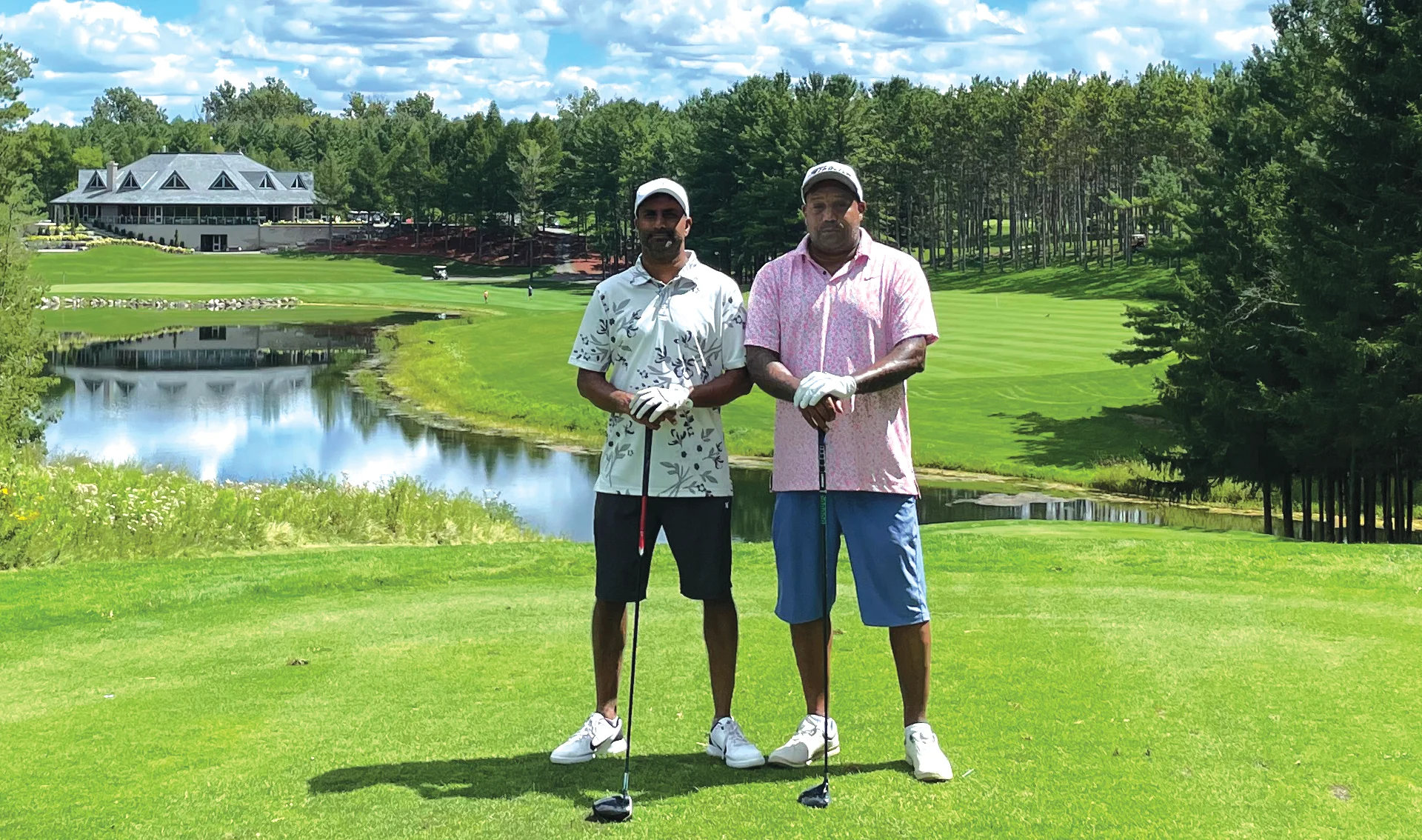 Kevin Lobo and his brother standing in an open golf field