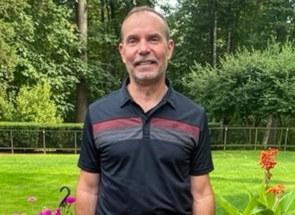 Mark in the garden at his home.