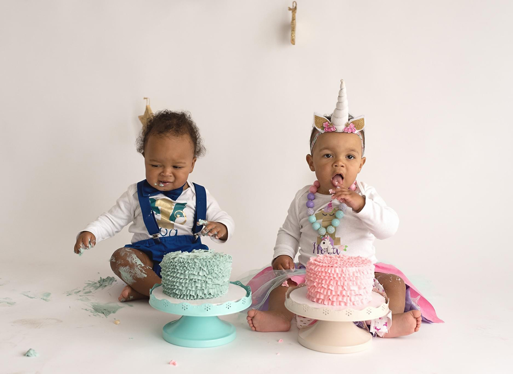Twins Koa and Nora eat birthday cake.