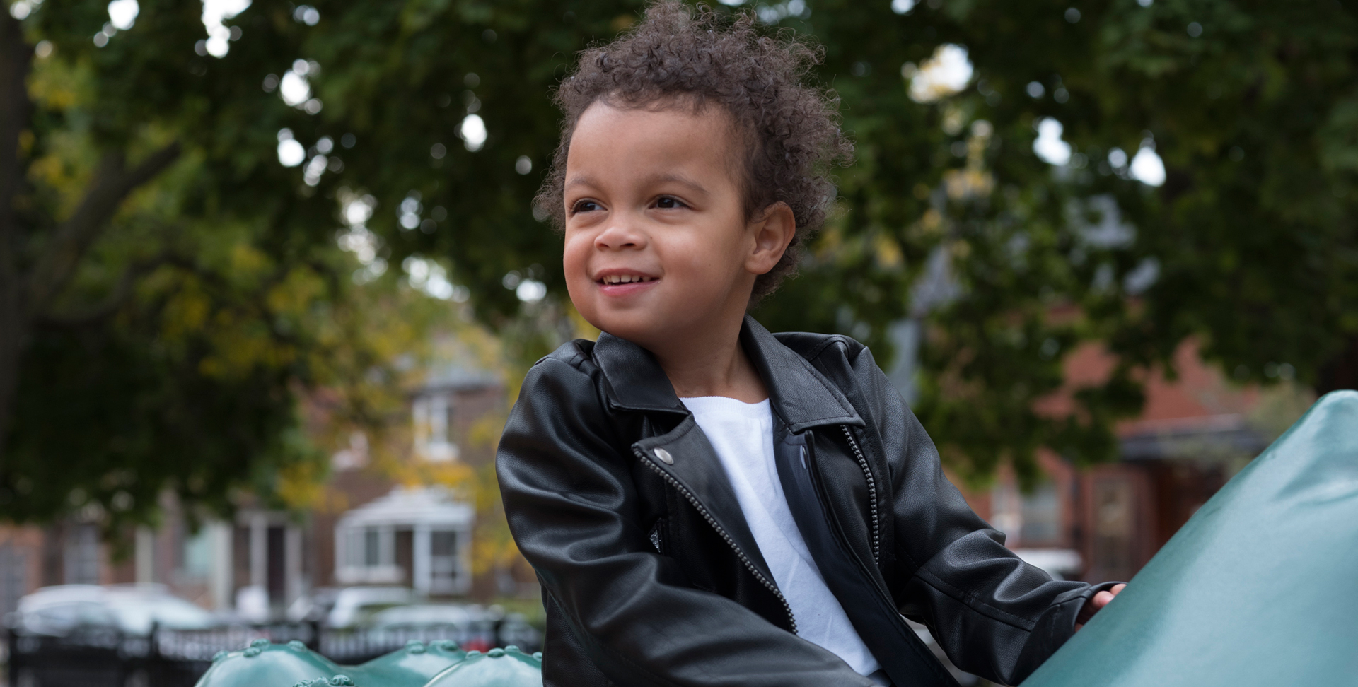 Three-year-old Nora plays in a park