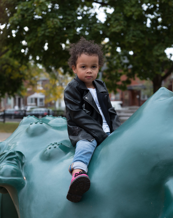 Three-year-old Nora plays in a park