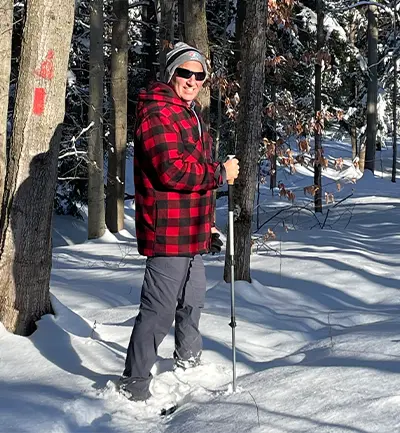 Paul King hiking through snow.
