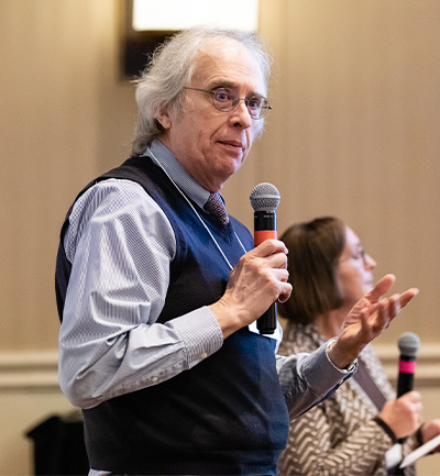 Dr. Robert Hegele delivering a speech.