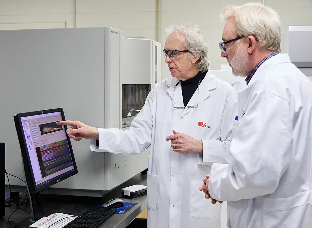 Dr. Robert Hegele in his lab with a research assistant.