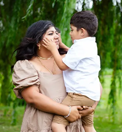 Suji Krishnan’s daughter, Rukmini Halliwell, holding son Zen.