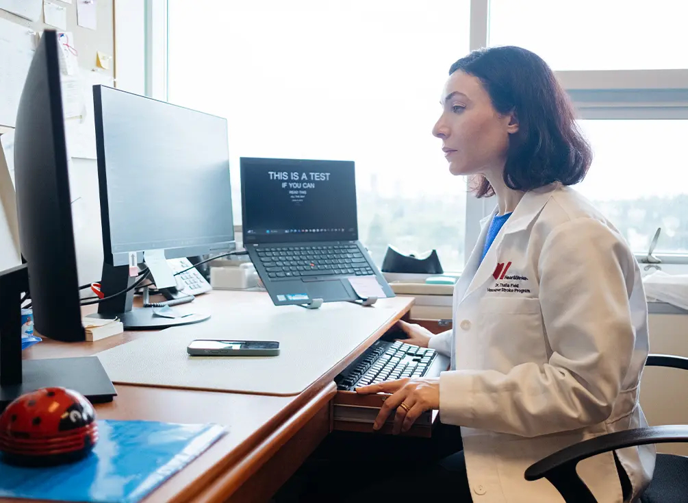 Dr. Thalia Field using her computer at her office.