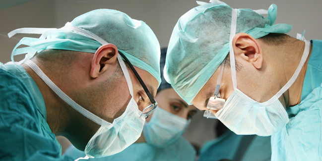 Three surgeons performing an operation.