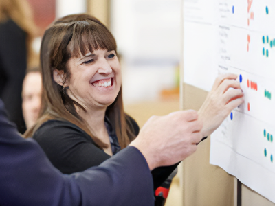 A woman viewing a bulletin board