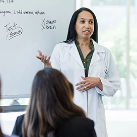 A woman doctor presenting.